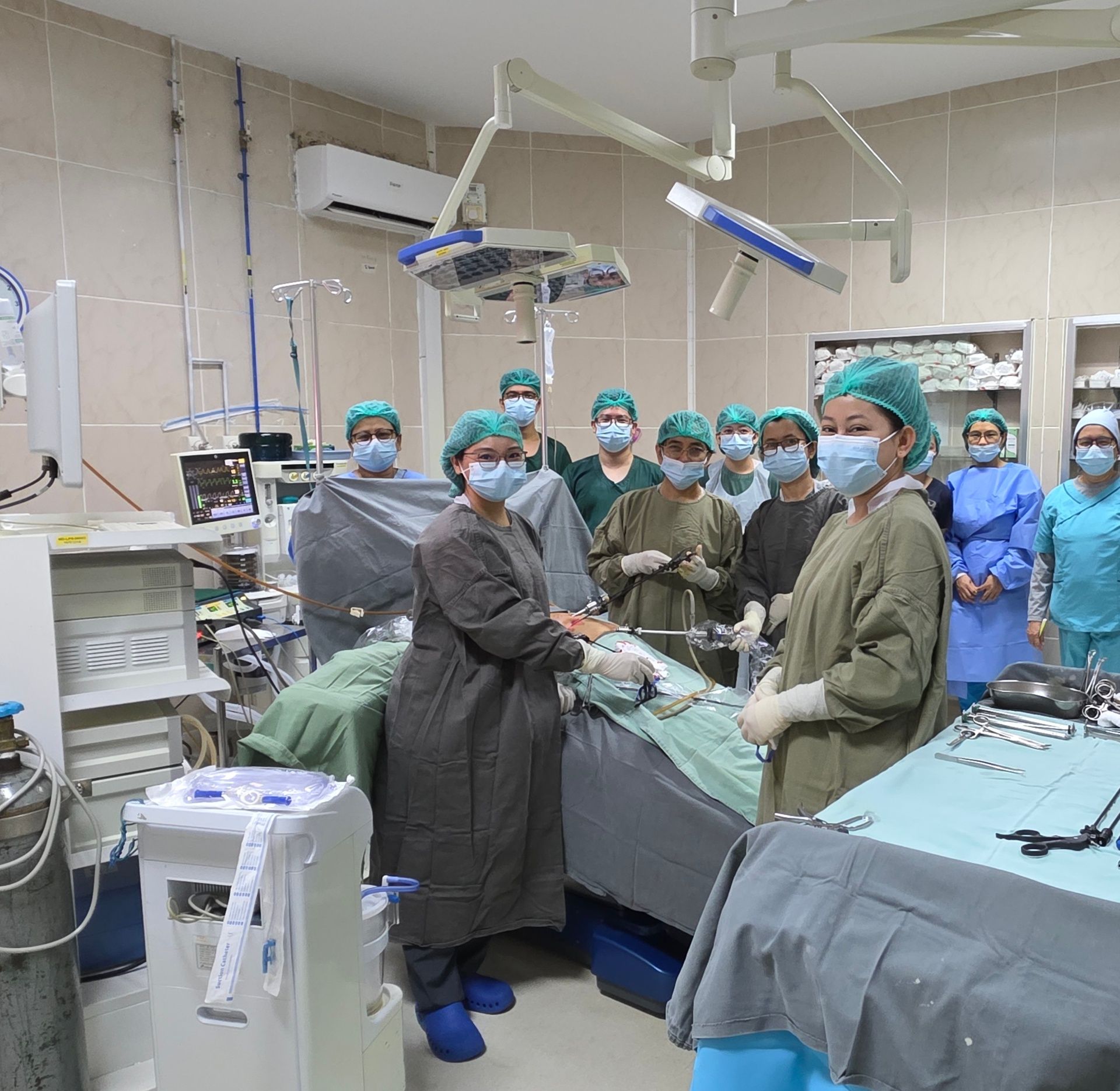 Surgical team in Yangon discussing a complex pregnancy oncology case